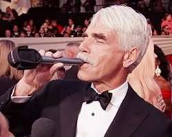 Sam Elliott consuming alcohol